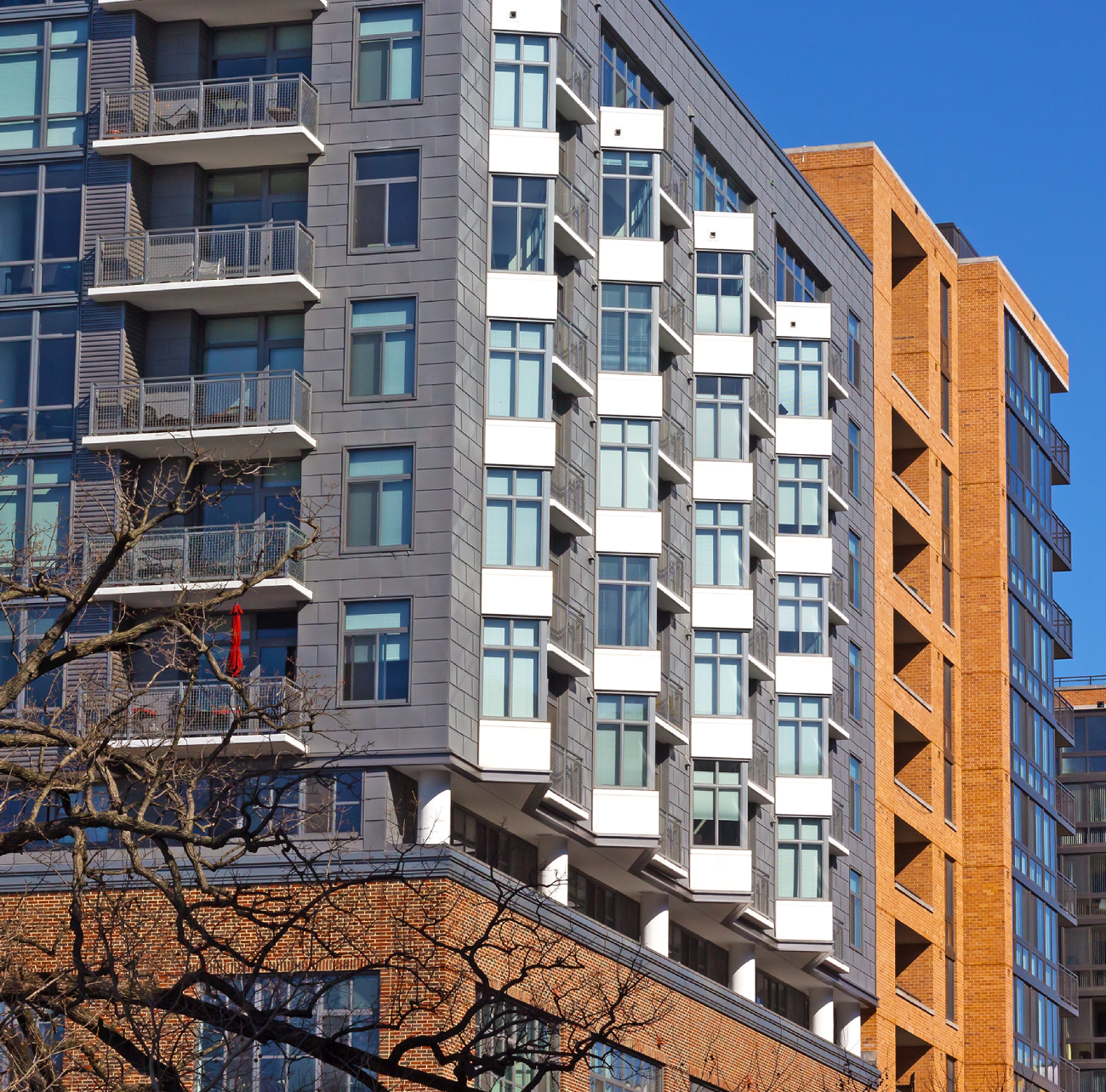 Modern apartment buildings with varied architectural styles and colors.