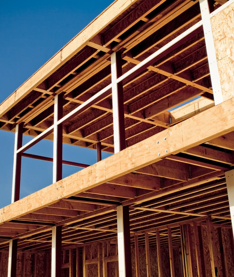 Architects reviewing building plans on table